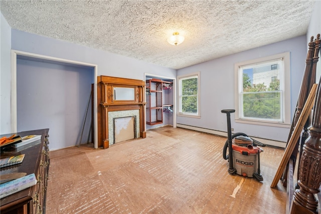 workout room featuring a textured ceiling