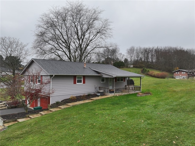 view of front of house featuring a garage and a front yard