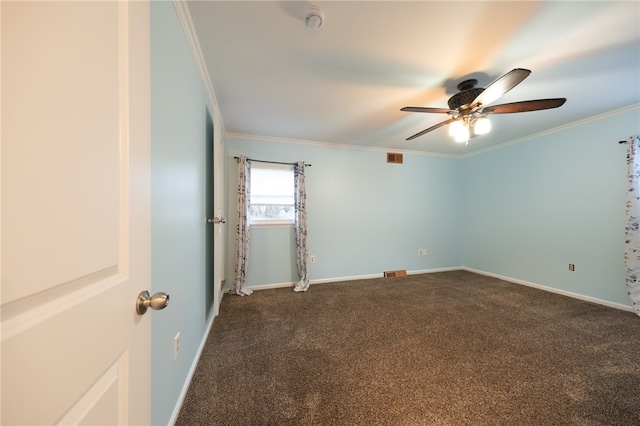 carpeted empty room featuring ceiling fan and crown molding