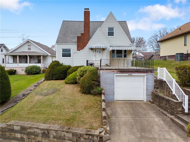 view of front facade with a front lawn and a garage