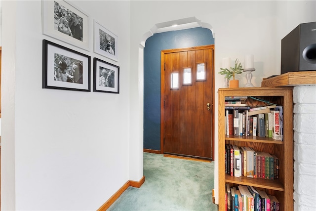 foyer entrance with light colored carpet