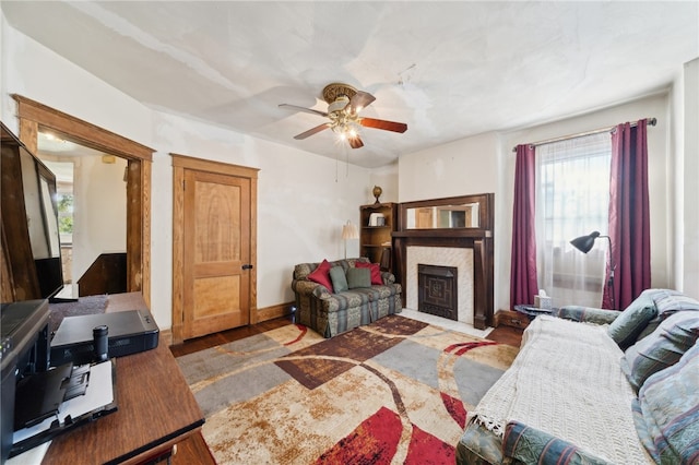 living room with dark hardwood / wood-style floors and ceiling fan