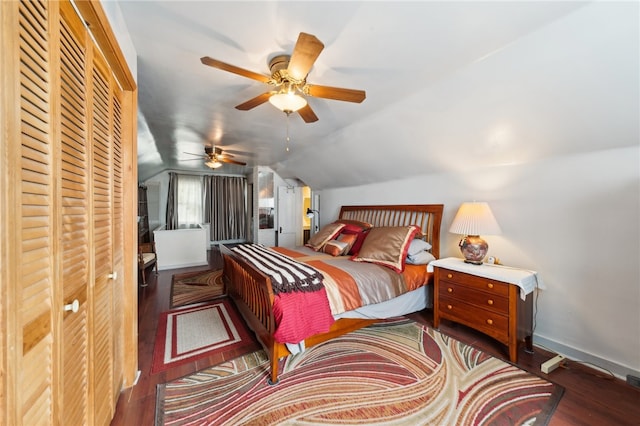 bedroom with dark hardwood / wood-style flooring, ceiling fan, and lofted ceiling