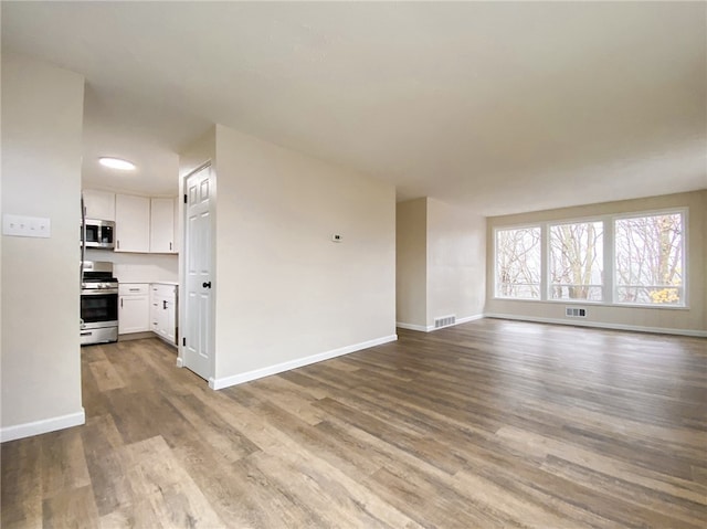 unfurnished living room with light hardwood / wood-style flooring