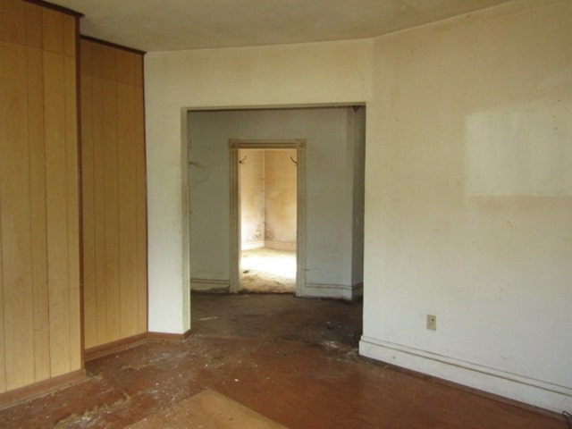 empty room with wood walls