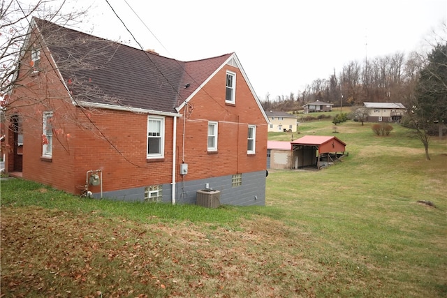 view of home's exterior with a lawn and cooling unit