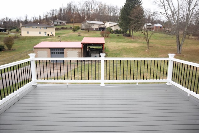 wooden terrace featuring a yard