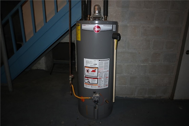 utility room featuring water heater