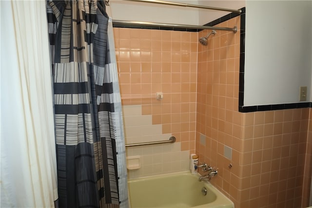 bathroom featuring shower / bath combination with curtain