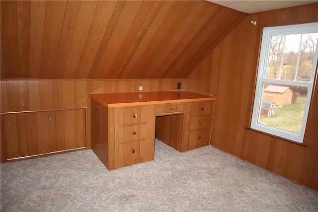 additional living space featuring light colored carpet, wooden ceiling, wooden walls, and vaulted ceiling