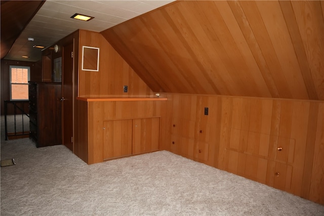 bonus room with wood walls, light colored carpet, lofted ceiling, and wooden ceiling