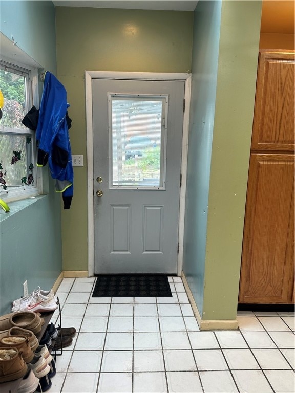 doorway featuring light tile patterned floors