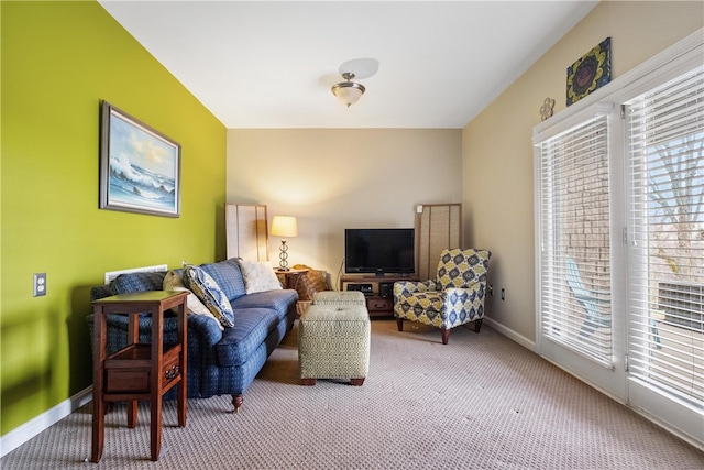 living room featuring a healthy amount of sunlight and carpet floors