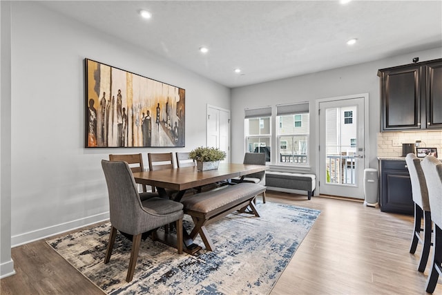 dining space with light hardwood / wood-style floors