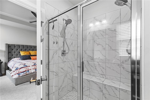 bathroom featuring ceiling fan and a shower with shower door