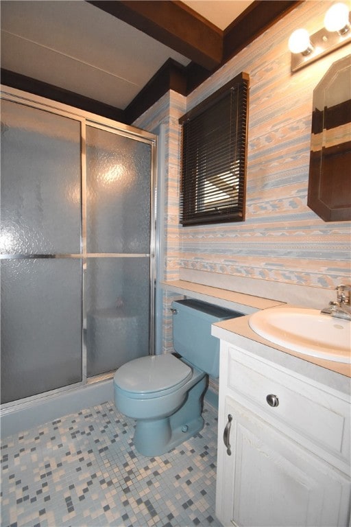 bathroom with tile patterned flooring, vanity, an enclosed shower, and toilet