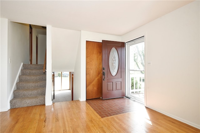 entryway with hardwood / wood-style flooring