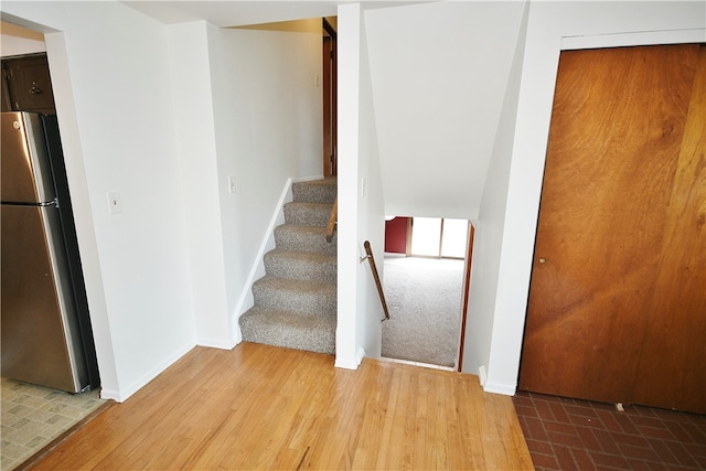 stairs with wood-type flooring