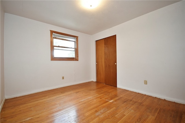 spare room featuring light hardwood / wood-style floors