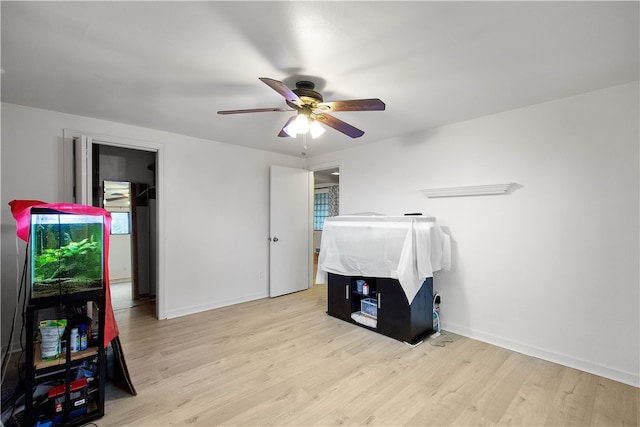 bedroom featuring light wood-type flooring and ceiling fan