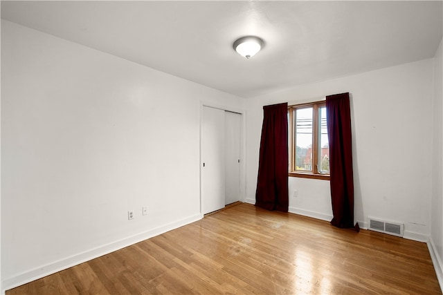 spare room featuring light wood-type flooring