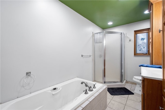 full bathroom with tile patterned flooring, vanity, separate shower and tub, and toilet