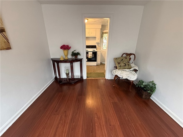 hall with dark hardwood / wood-style floors