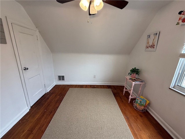 bonus room with ceiling fan, dark hardwood / wood-style floors, and vaulted ceiling