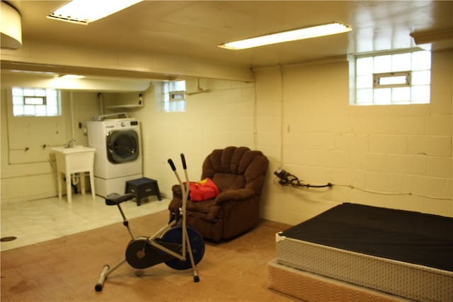 exercise room with washer / clothes dryer