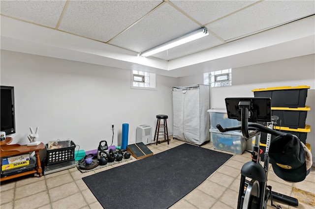 exercise area featuring a paneled ceiling