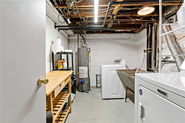 laundry area featuring washer and clothes dryer and gas water heater