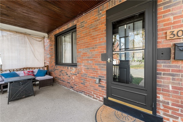 entrance to property featuring a porch