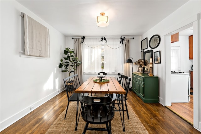 dining area with dark hardwood / wood-style floors