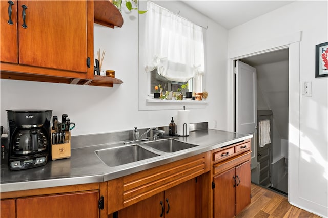 kitchen with light hardwood / wood-style floors and sink