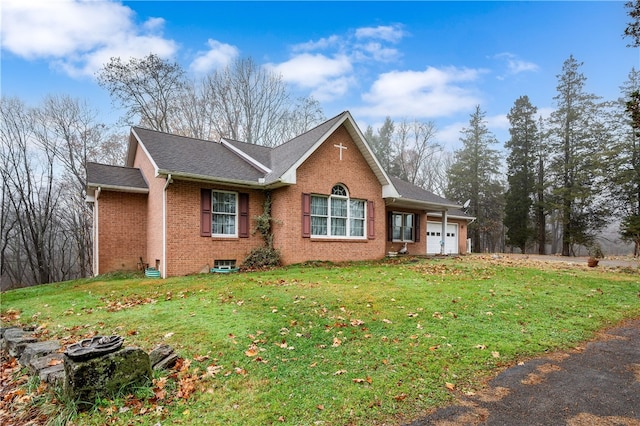 view of front facade featuring a garage and a front lawn