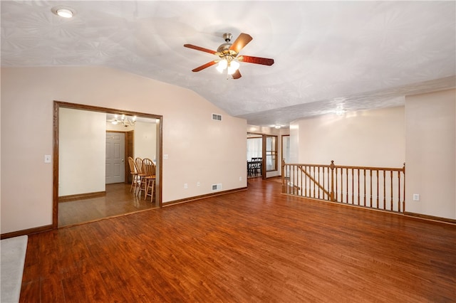 spare room with hardwood / wood-style flooring, ceiling fan, and vaulted ceiling