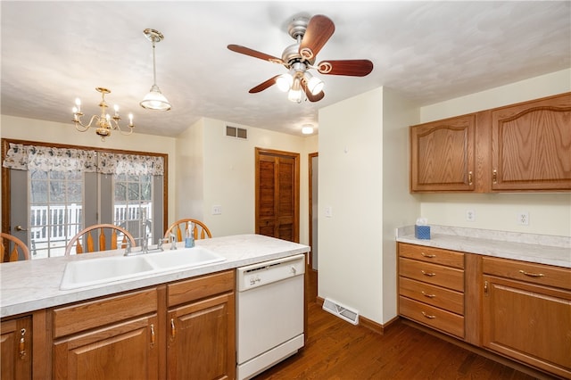 kitchen with dishwasher, ceiling fan with notable chandelier, sink, hanging light fixtures, and dark hardwood / wood-style floors