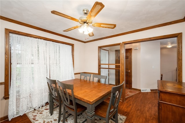 dining room featuring ceiling fan, ornamental molding, and hardwood / wood-style flooring