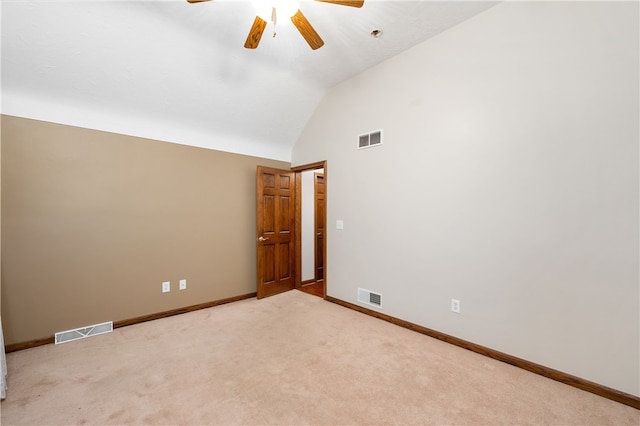 unfurnished room featuring ceiling fan, lofted ceiling, and light carpet