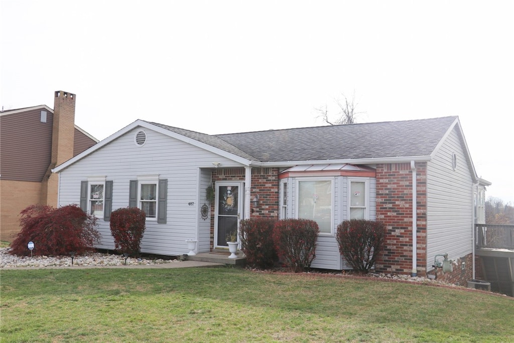 ranch-style house with a front yard