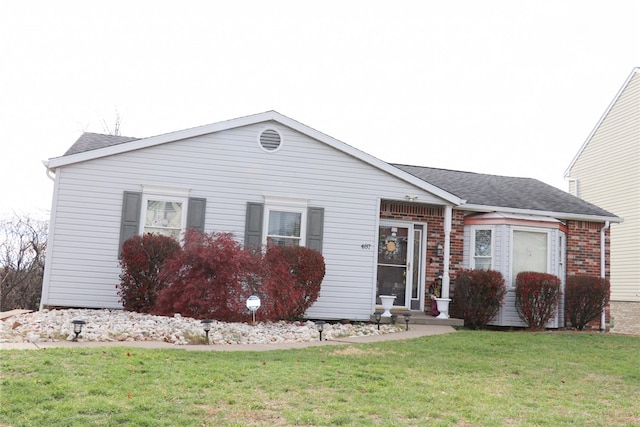 ranch-style home featuring a front yard