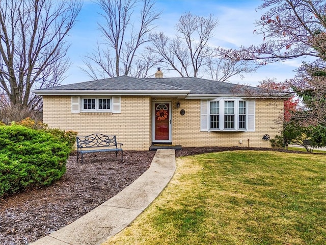 ranch-style home featuring a front yard