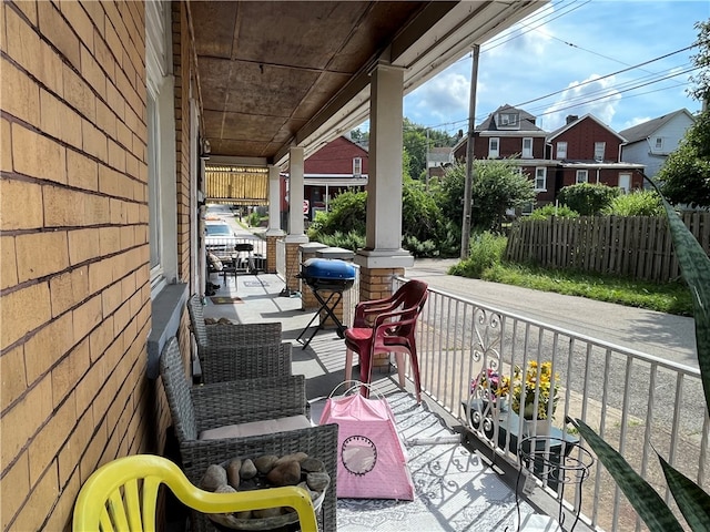 wooden terrace featuring covered porch