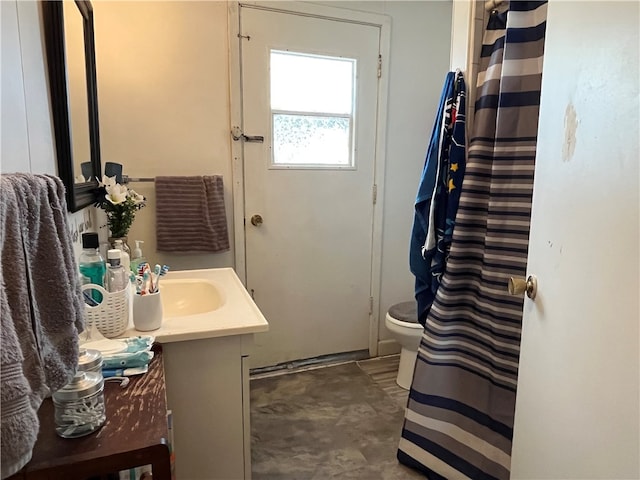 bathroom with vanity and toilet