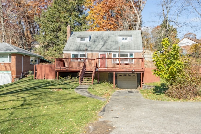 view of front of property with a deck, a front lawn, and a garage