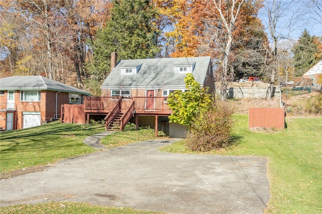 view of front facade featuring a front yard and a deck