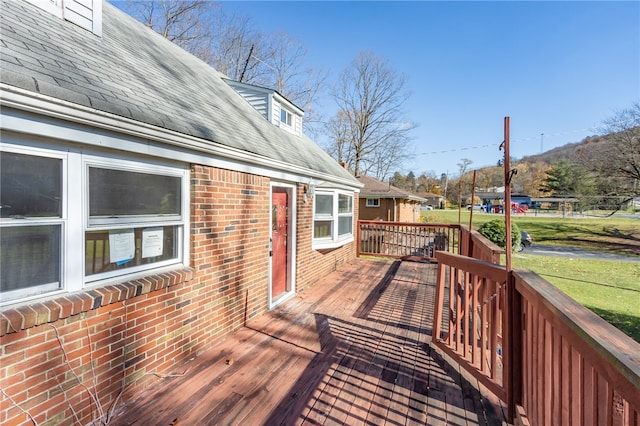 wooden terrace with a yard