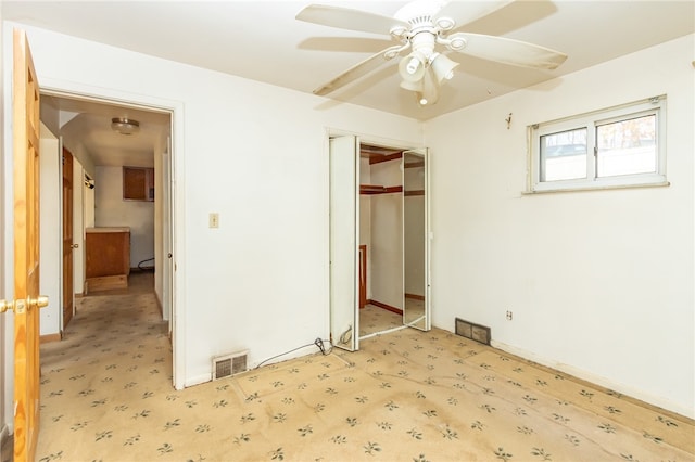 unfurnished bedroom featuring a closet and ceiling fan