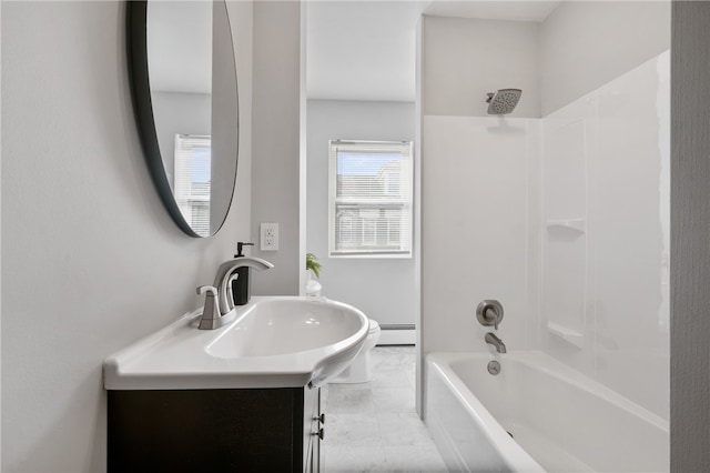 bathroom featuring baseboard heating, shower / washtub combination, and vanity