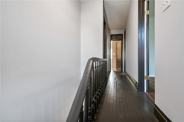 hall with dark wood-type flooring